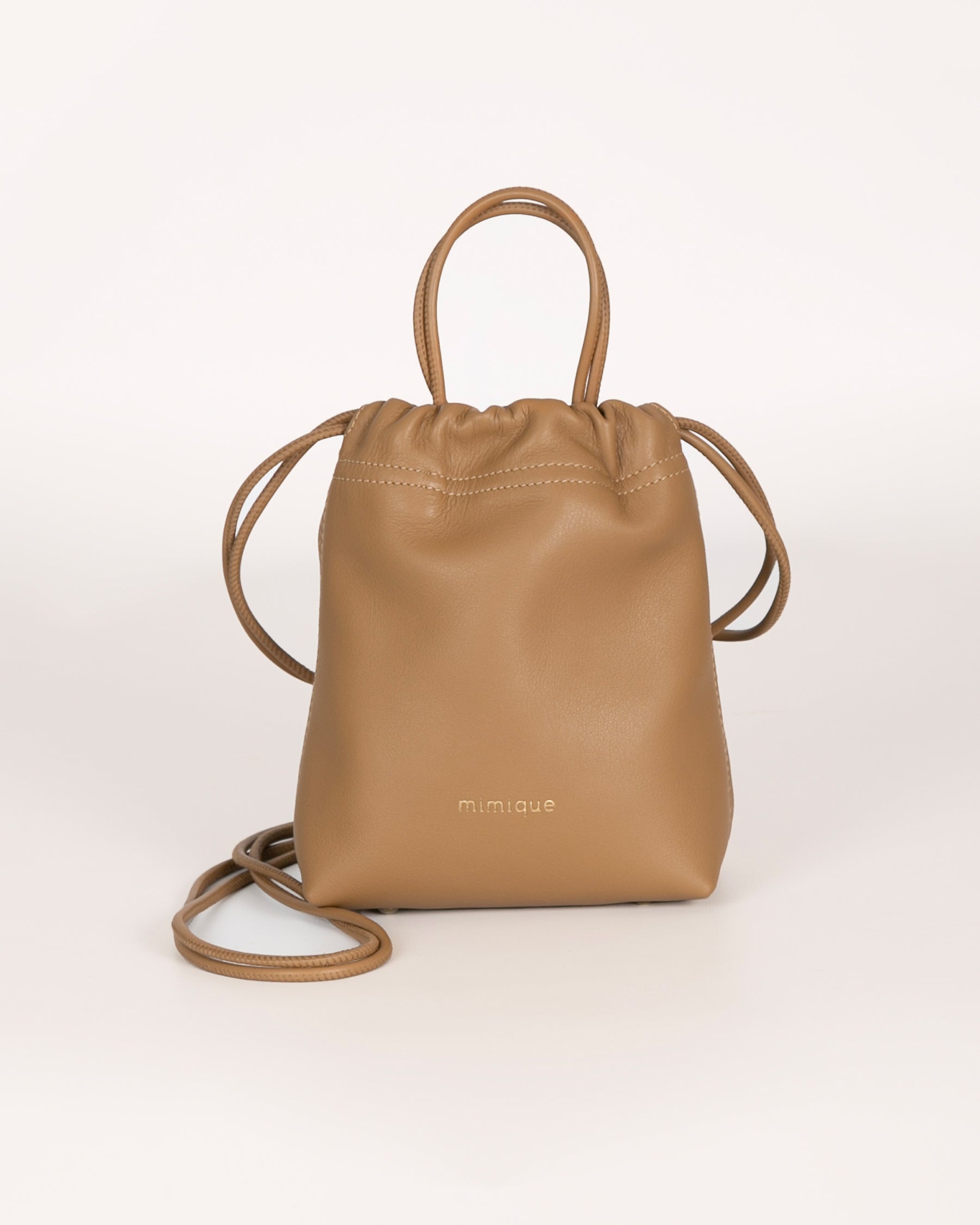 Bolso Cue de Mimique. Bombonera piel color camel moka. Hecho en España