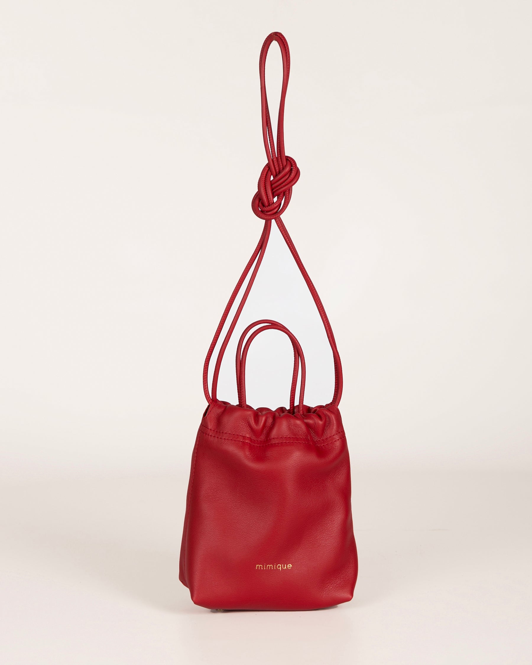 Bolso bombonera bandolera piel Cue de Mimique. Color rojo. Made in Spain