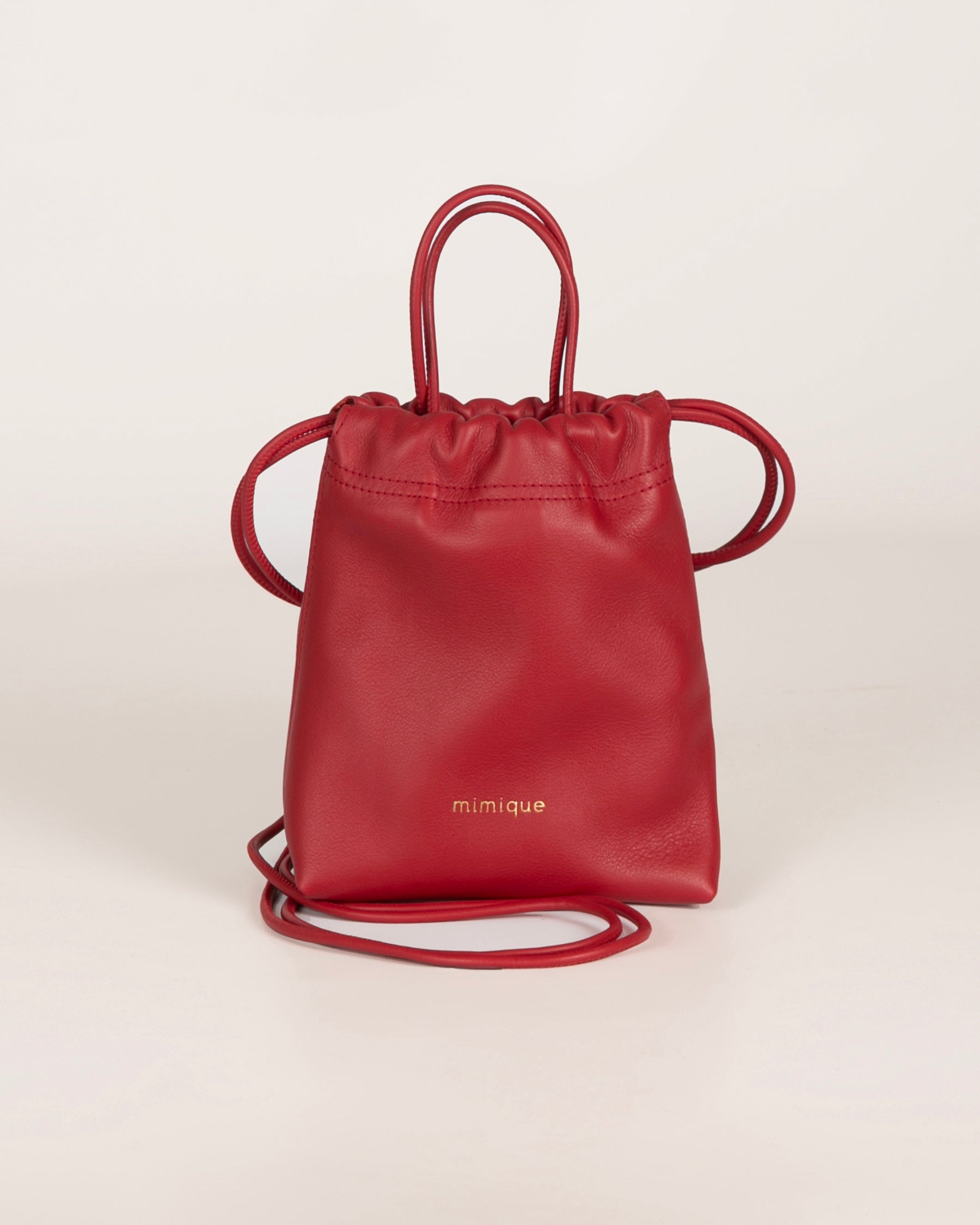 Bolso bombonera bandolera piel Cue de Mimique. Color rojo. Made in Spain
