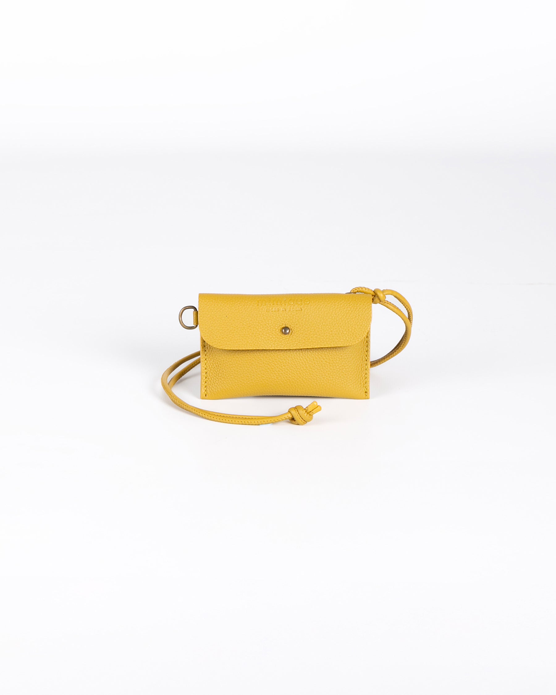 Funda multiusos de piel Mimique color mostaza. Práctica y versátil