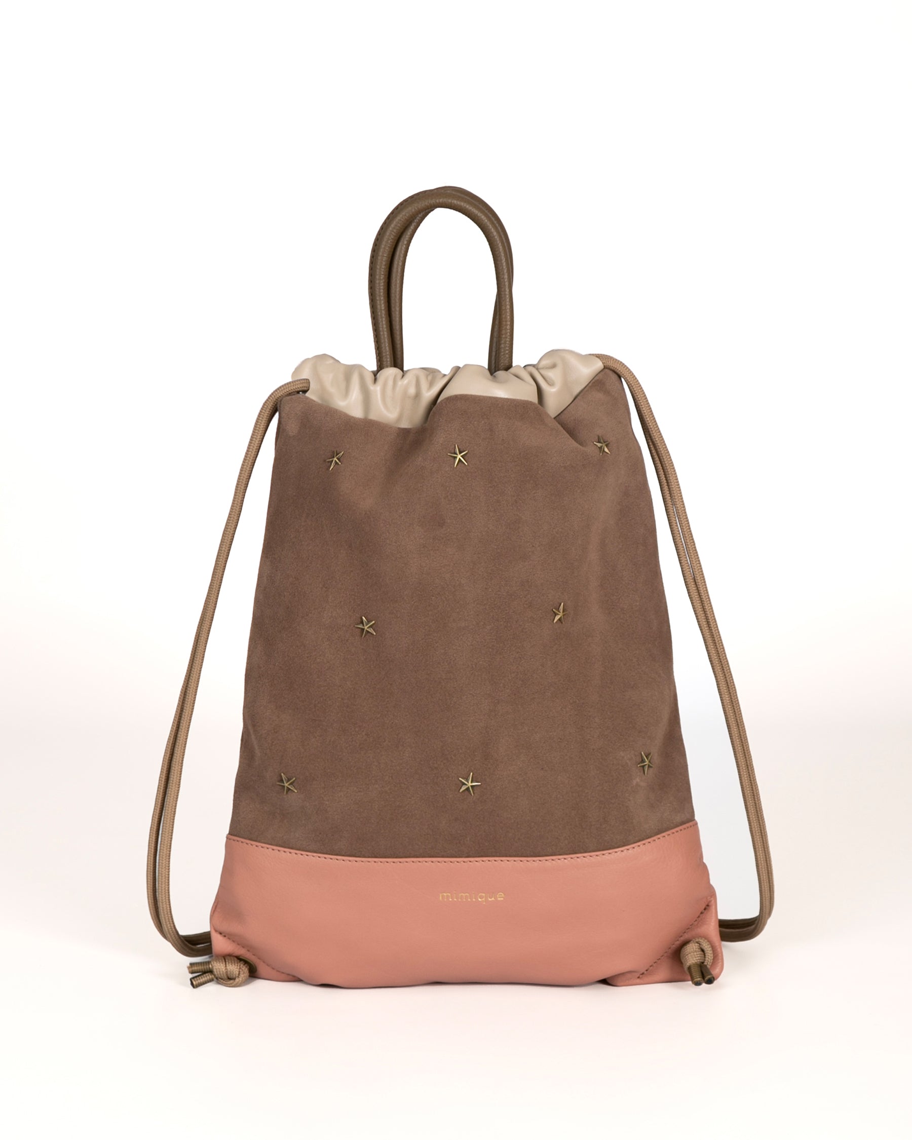 Mochila bolso con tachuelas de Mimique en piel y serraje color topo y maquillaje. Hecho en España