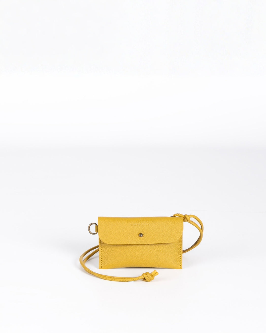 Funda multiusos de piel Mimique color mostaza. Práctica y versátil