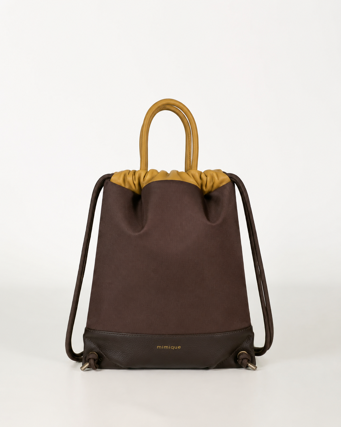 Mochila bolso Atalaya marrón chocolate en piel y loneta impermeable cómoda y ligera hecha a mano en España