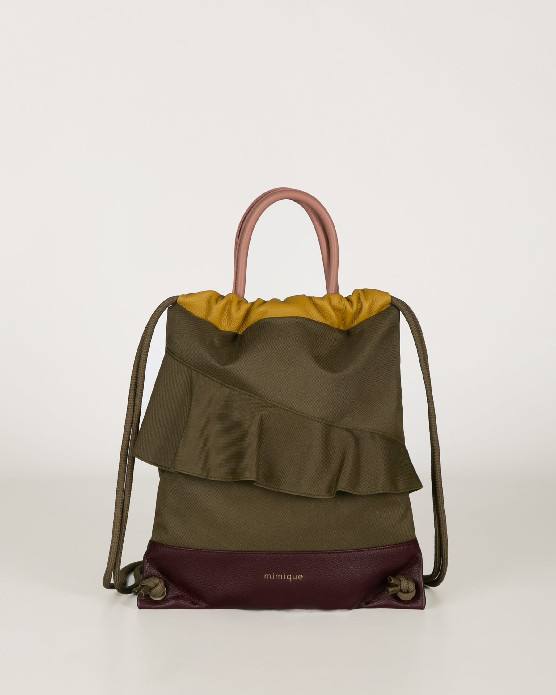 Mochila bolso de mujer de piel y loneta impermeable verde caqui y burdeos Zahora mini de Mimique. Diseño artesanal hecho en España. Cómoda, ligera y atemporal