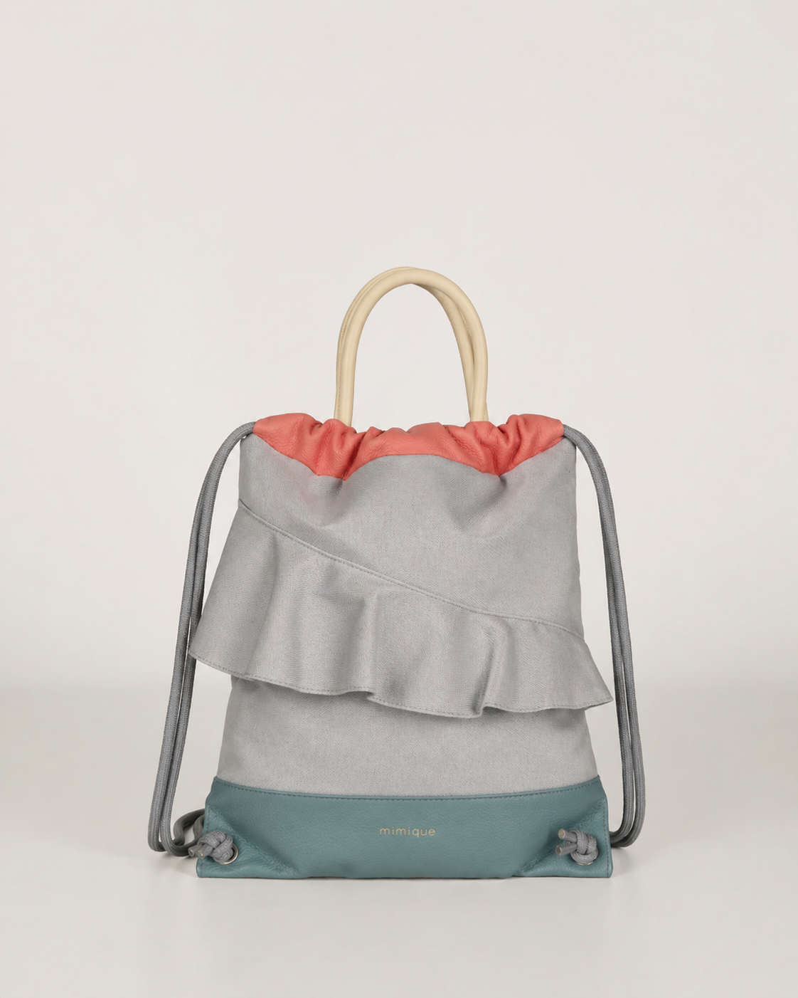 Mochila bolso de mujer de piel y loneta impermeable con volante aguamarina y gris Zahora mini de Mimique. Made in Spain
