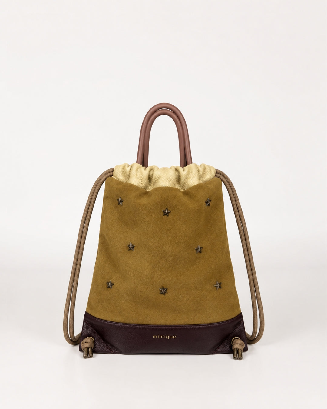 Mochila de piel y serraje camel Tachuelas mini estrellas Mimique para mujer hecha en España cómoda y elegante