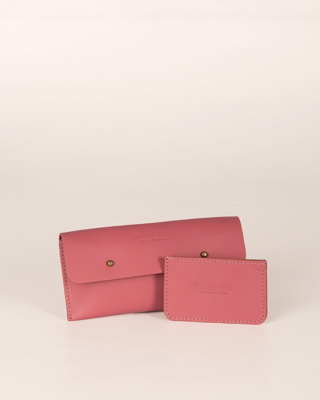 Pack Funda de móvil y tarjetero Mimique en piel rosa frambuesa. Calidad hecha en España