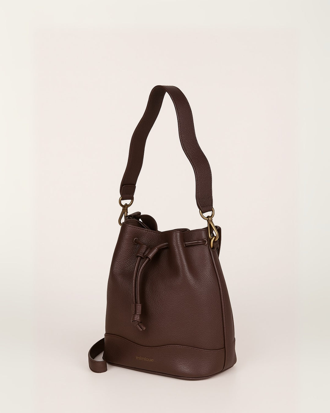 Bolso bombonera de piel para mujer Serín Mimique. Color marrón chocolate. Hecho en España