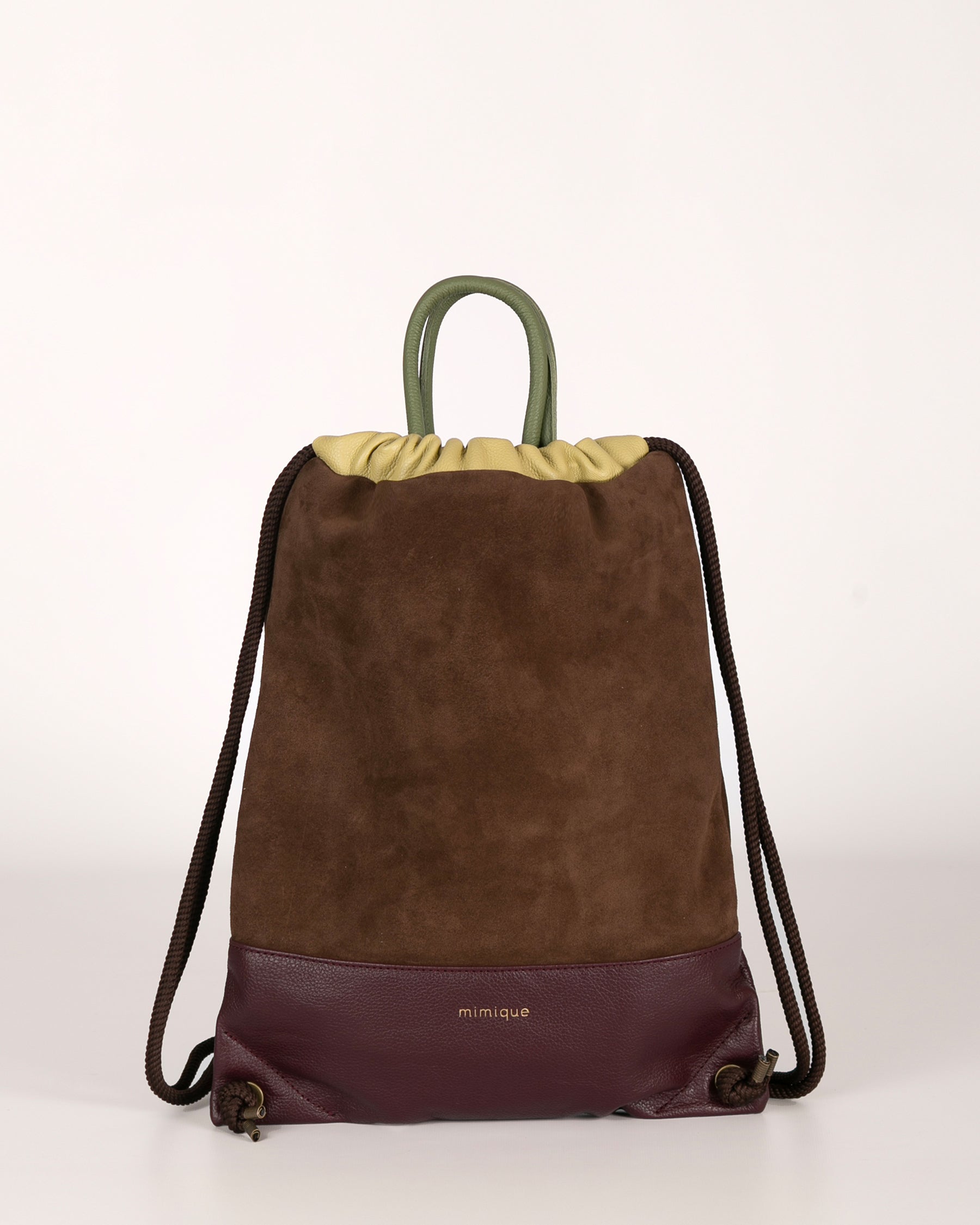 Mochila para mujer Arra de Mimique. En piel y ante de gran calidad color marrón chocolate y burdeos