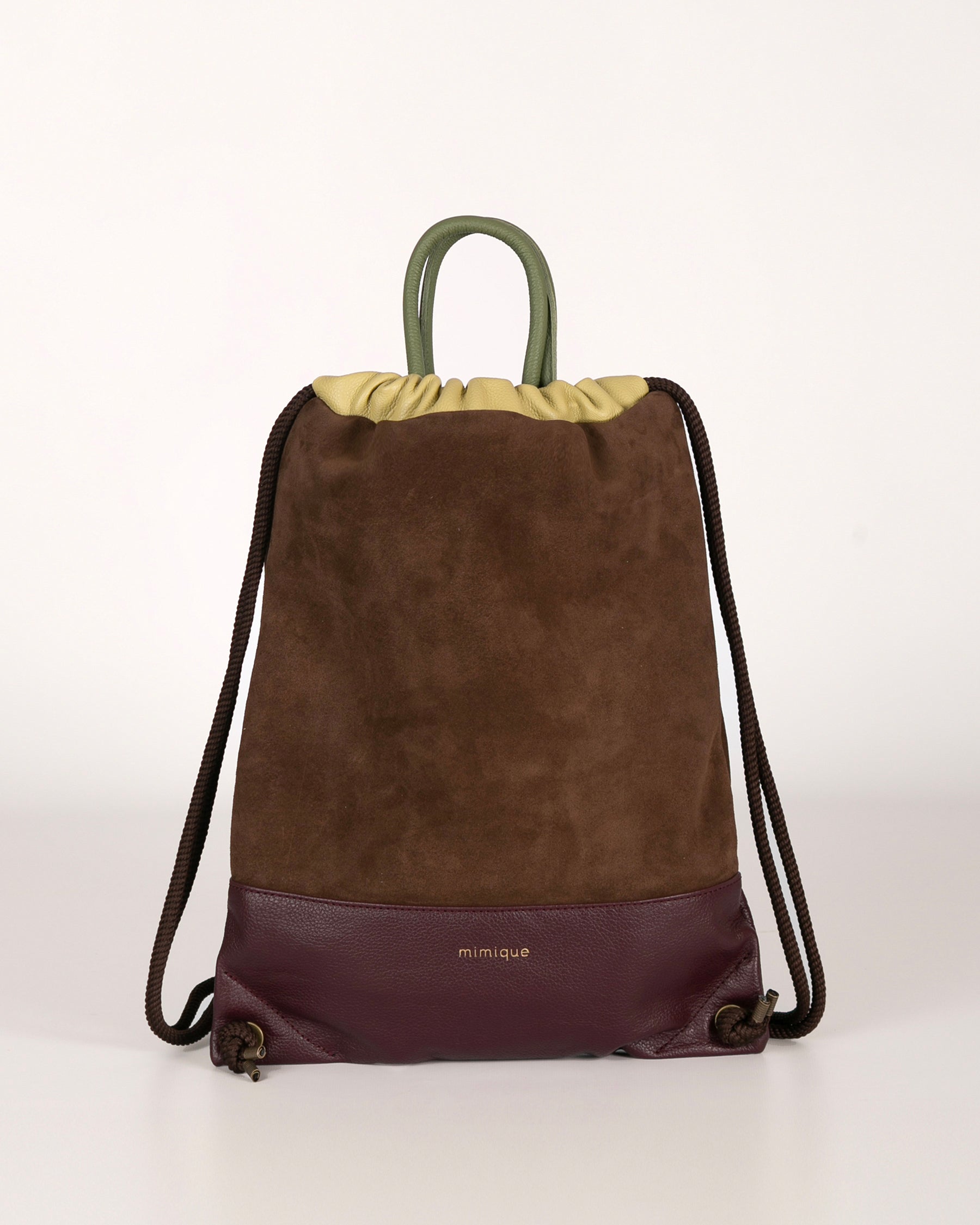 Mochila para mujer Arra de Mimique. En piel y ante de gran calidad color marrón chocolate y burdeos