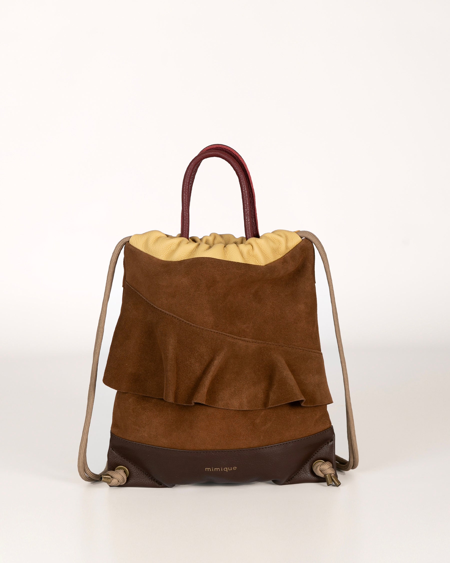 Mochila con volate para mujer Bolonia mini de Mimique. De piel y serraje marrón. Hecha en España