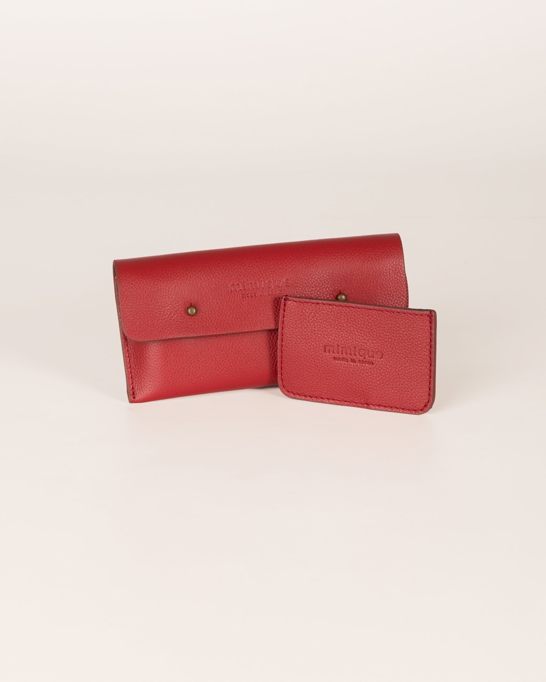Pack Funda de móvil y tarjero de piel Mimique. Color rojo guinda. Calidad Made in Spain