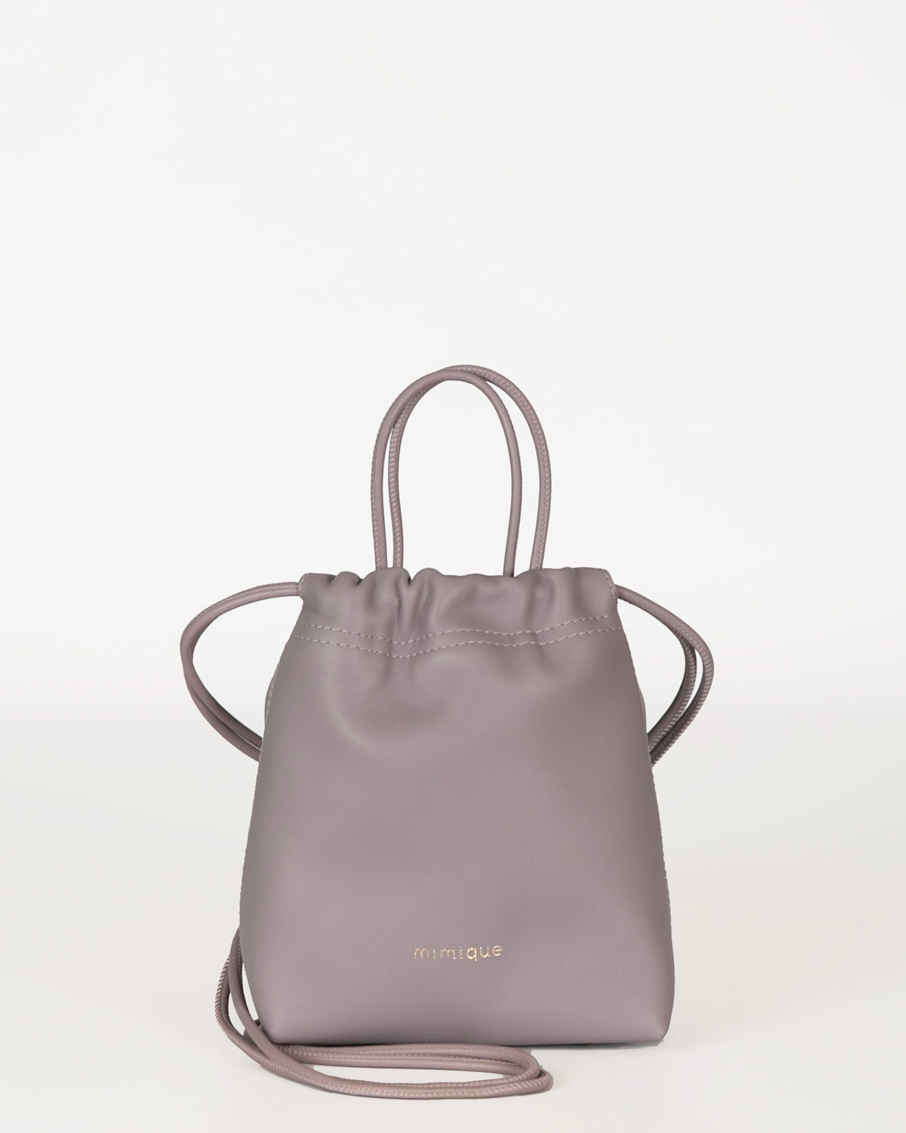 Bolso bombonera Cue color morado lila lavanda para mujer en piel de gran calidad. Diseño atemporal, cómodo y ligero. Hecho en España - Mimique
